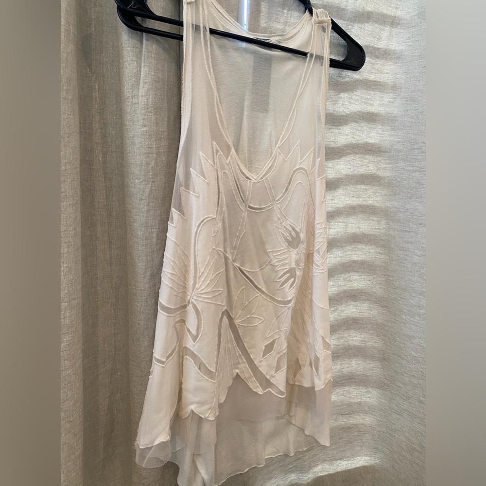 Free People white sleeveless tank with sheer cut out detail. XS